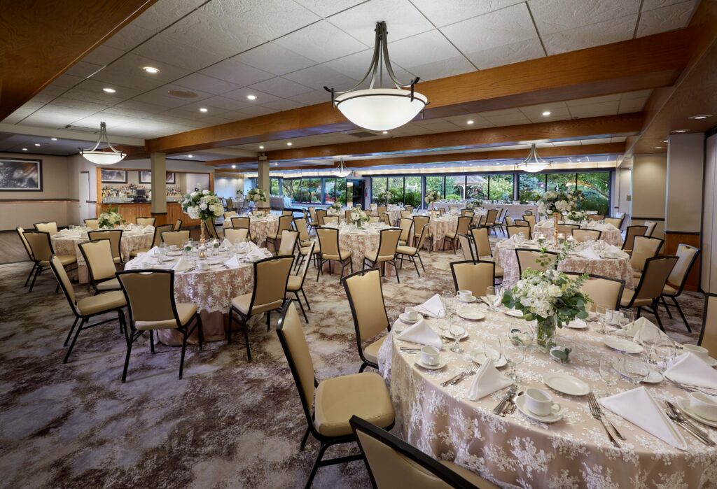 Many tables and chairs are set up for an upcoming banquet at the East Garden Room.
