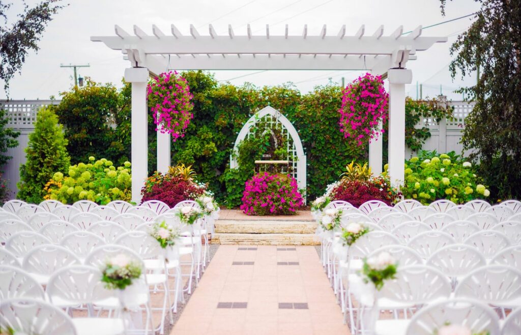 White altar and chairs featured at the West Patio.